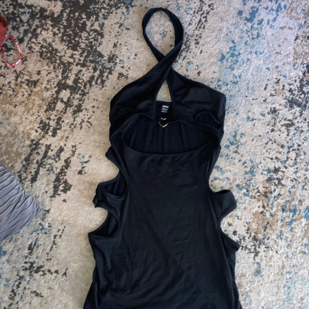 Beautiful criss cross black dress with heart accessory